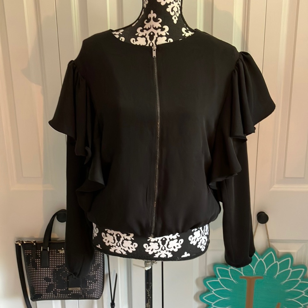 Just listed💋 super fun black polyester spandex bomber jacket with ruffle detail